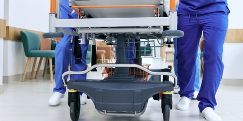 Gurney being pushed into an emergency room